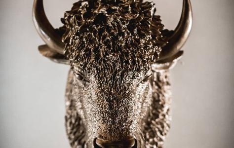 A bronze bison sculpture, part of the venue's eclectic decor